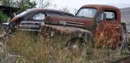 1948 Ford in the background, 1950 Ford pickup in foreground